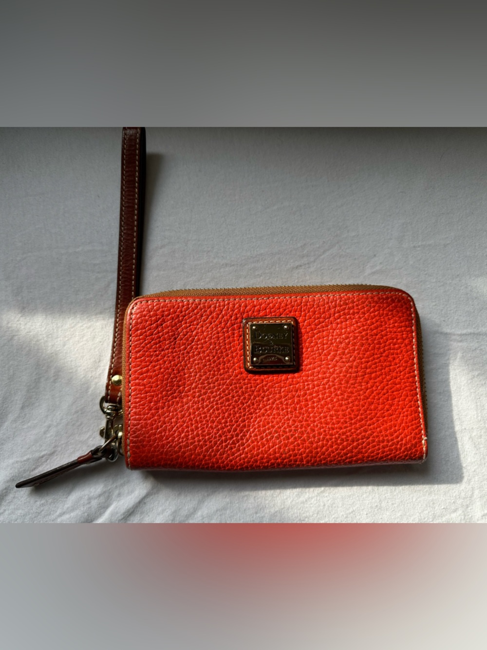 Dooney & Bourke Pebble Leather Large Zip Around Wrislet (ORANGE)